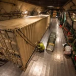 U.S. Airmen load Foreign Military Sales (FMS) cargo onto an Antonov AN-124 aircraft at Travis Air Force Base. S&K Aerospace was awarded a $4.3 billion contract to manage FMS parts and logistics for over 100 partner nations. (Photo: Kenneth Abbate / U.S. Air Force / DVIDS)