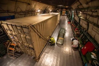 U.S. Airmen load Foreign Military Sales (FMS) cargo onto an Antonov AN-124 aircraft at Travis Air Force Base. S&K Aerospace was awarded a $4.3 billion contract to manage FMS parts and logistics for over 100 partner nations. (Photo: Kenneth Abbate / U.S. Air Force / DVIDS)