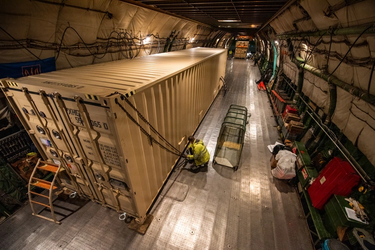 U.S. Airmen load Foreign Military Sales (FMS) cargo onto an Antonov AN-124 aircraft at Travis Air Force Base. S&K Aerospace was awarded a $4.3 billion contract to manage FMS parts and logistics for over 100 partner nations. (Photo: Kenneth Abbate / U.S. Air Force / DVIDS)
